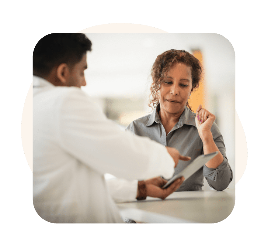 A Doctor Providing Additional Information on Savings Programs to a Patient